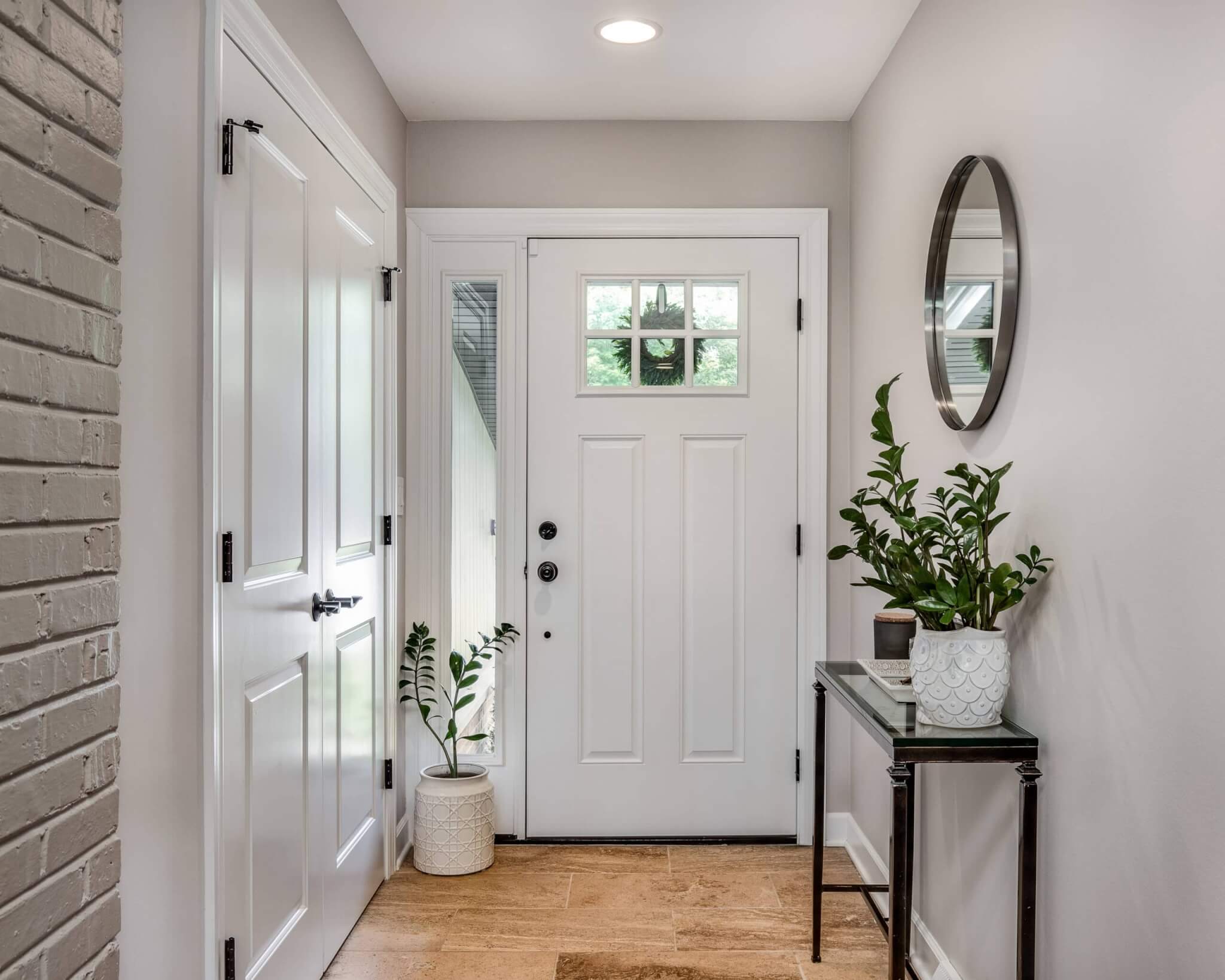 A cozy entryway with brown walls and a white front door. Illustration 1 of 3 for How to Choose Foyer Paint Color: 7 Proven Tips for Purcellville Homeowners